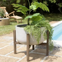 Macabane Pot de fleur rond en béton sur pieds en acacia marron HECTOR